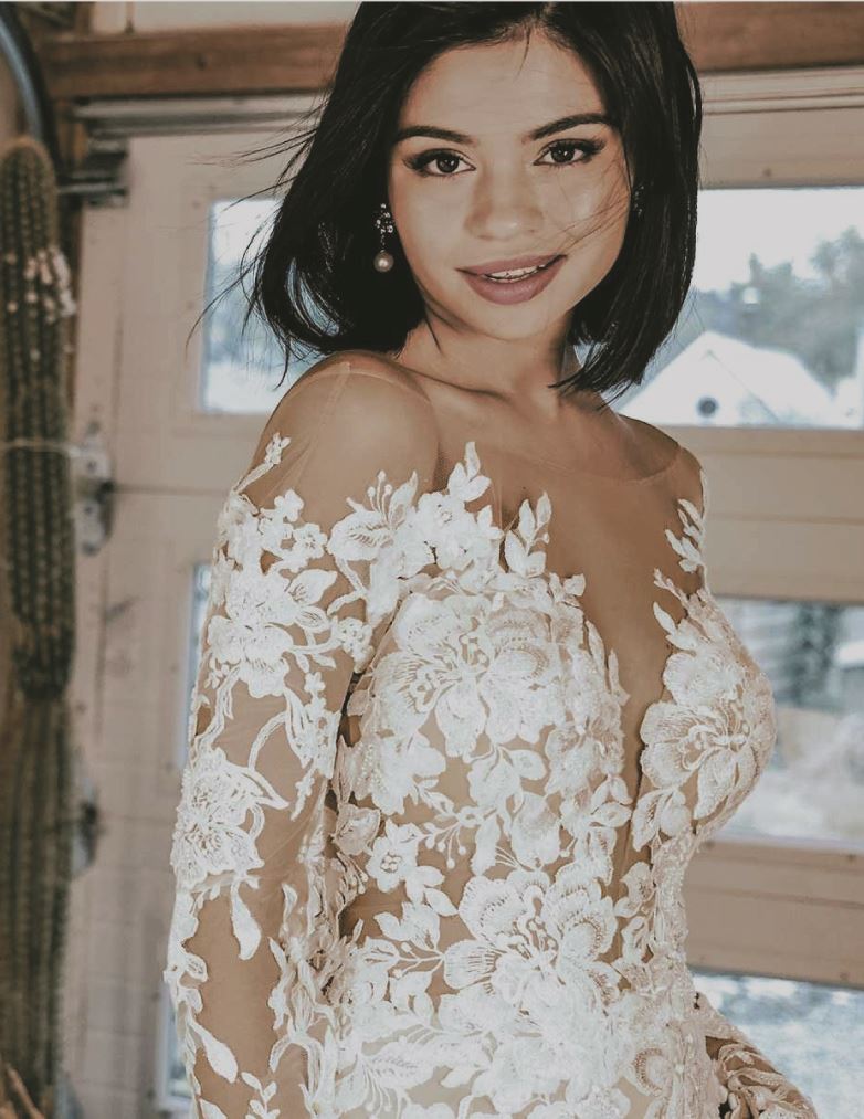 Model with short hair wearing an Essense of Australia wedding gown